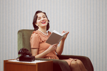 Smiling woman reading book