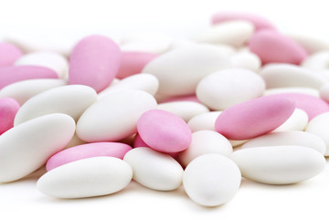 heap of white and pink sugared almonds