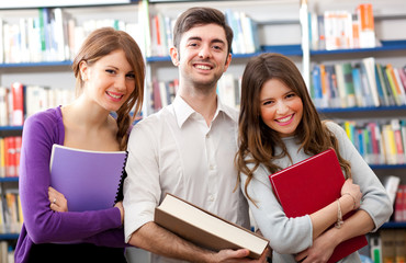 Smiling students in a library