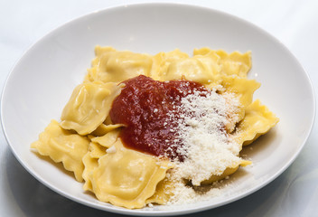 Italian pasta with napolitan sauce and parmesan cheese