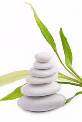 Zen stones isolated on white background with bamboo