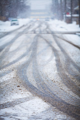 Snow-covered road, the marks of wheels.