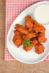 top view chicken wings with sauce