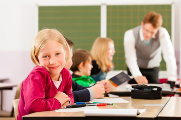 Fototapeta premium Education - Pupils and teacher learning at school