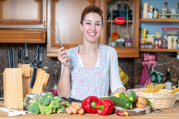 beautiful housewife cooking vegetables