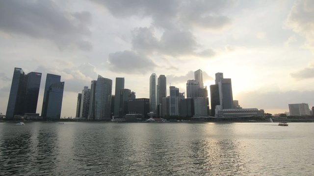 Singapore City Skyline with Moving Clouds at Sunset Timelapse