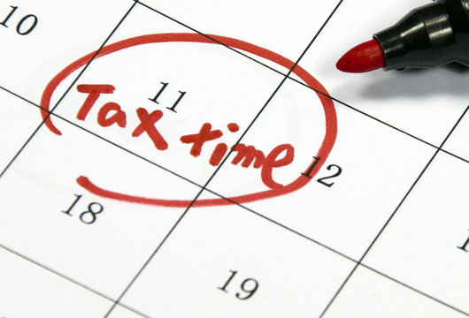 tax time sign written with pen on calendar