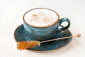 cup of latte or cappuccino and caramel sugar