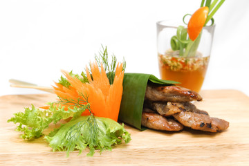 Roast pork wrapped in banana leaves