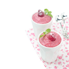 Raspberry mousse decorated with mint and fresh raspberries