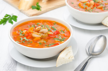 Vegetable soup with white beans in a bowl