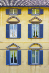 Italian architecture.Colorful windows and facade in Venice