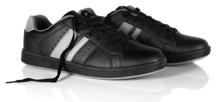 Black new sneakers with unfastened shoe laces