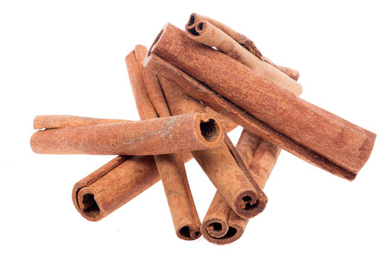 heap of cinnamon isolated on white