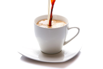 Milk and coffee poured in a cup