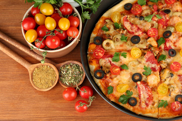 colorful composition of delicious pizza, vegetables and spices