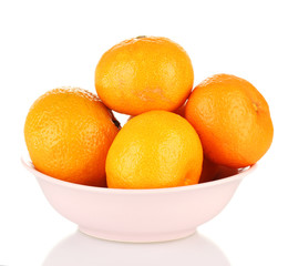 Tasty mandarines in color bowl isolated on white