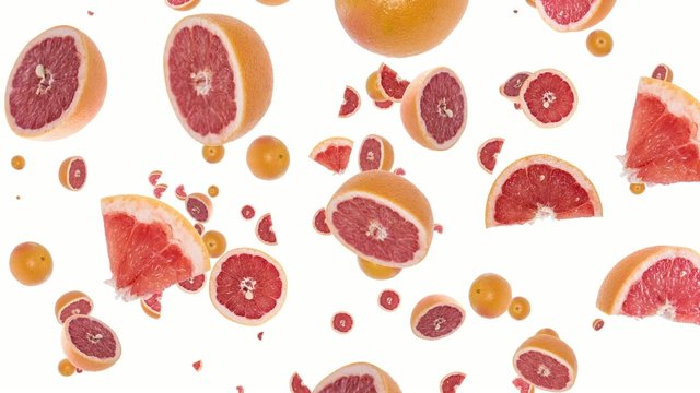 Grapefruits falling down on white background