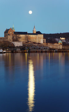 Full moon over Akershus castle. Reflection.