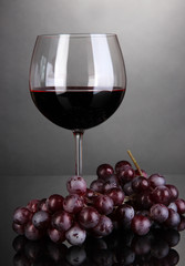 Red wine glass on grey background