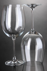 Empty wine glasses arranged on grey background