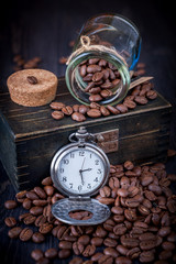 Coffee and vintage watch on a chain