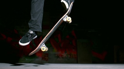Skater doing ollie trick on concrete