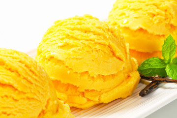 Fototapeta na wymiar Scoop of yellow ice cream