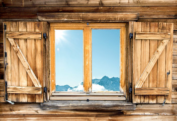 weathered mountain hut window shutter