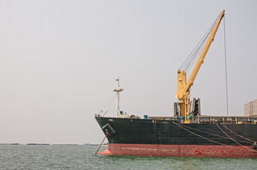 Fototapeta premium cargo ship with crane
