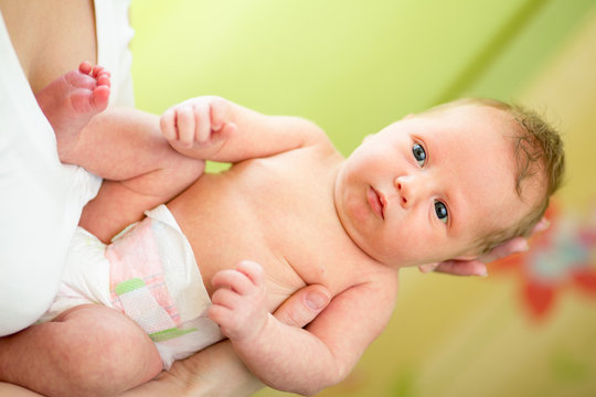 newborn baby boy in mother's hands