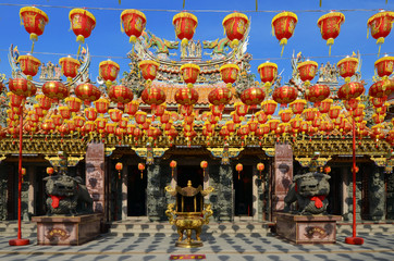 illuminated chinese lanterns hanging in chiness temple for new y