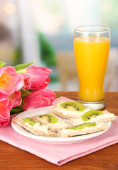 Tasty canapes with cheese and kiwi,