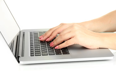 Fototapeta na wymiar Female hands writing on laptop, isolated on white