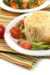 Delicious risotto with vegetables isolated on white
