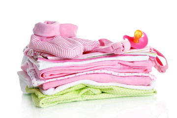 Pile of baby clothes isolated on white