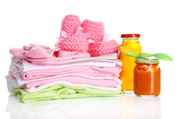 Pile of baby clothes isolated on white