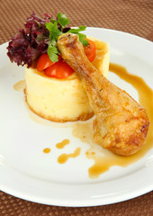 Small portion of food on big plate close up