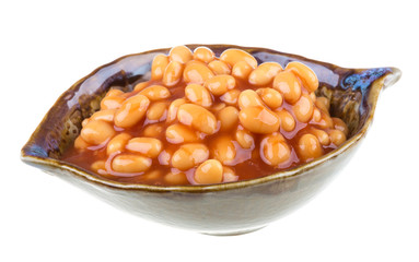Marinated haricot beans in tomato sauce with shallots on a plate