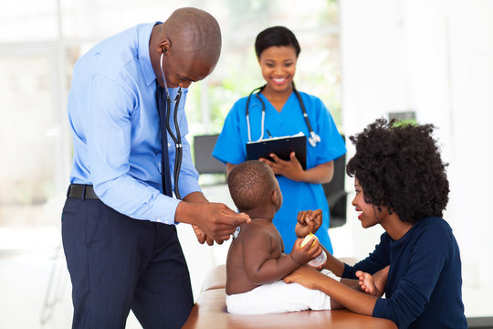 pediatric doctor examining a child
