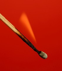 Match on red background