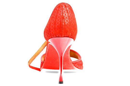 Red high heel over white