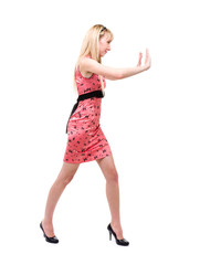 Woman pushing something imaginary