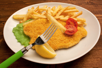 Cotoletta e patatine fritte