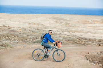 Fototapeta premium Woman on the bike on a summer day