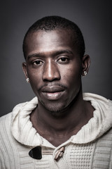 Confident young african man close up portrait.