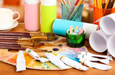 Artistic equipment: paint, brushes and art palette