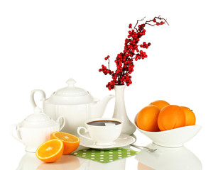Beautiful white dinner service with oranges isolated on white