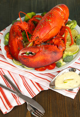 Red lobster on platter on table close-up