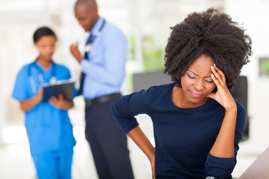 Female Sick Patient In Doctor's Office